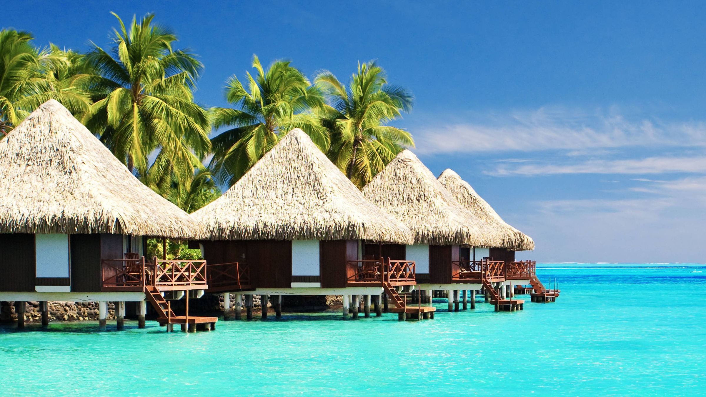 Overwater villas on a turquoise lagoon